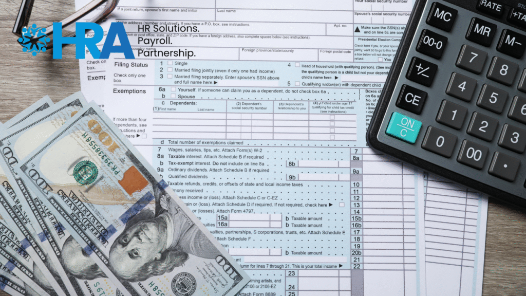 Sugar Land small business owner preparing year-end payroll tax documents and W-2 forms for employees